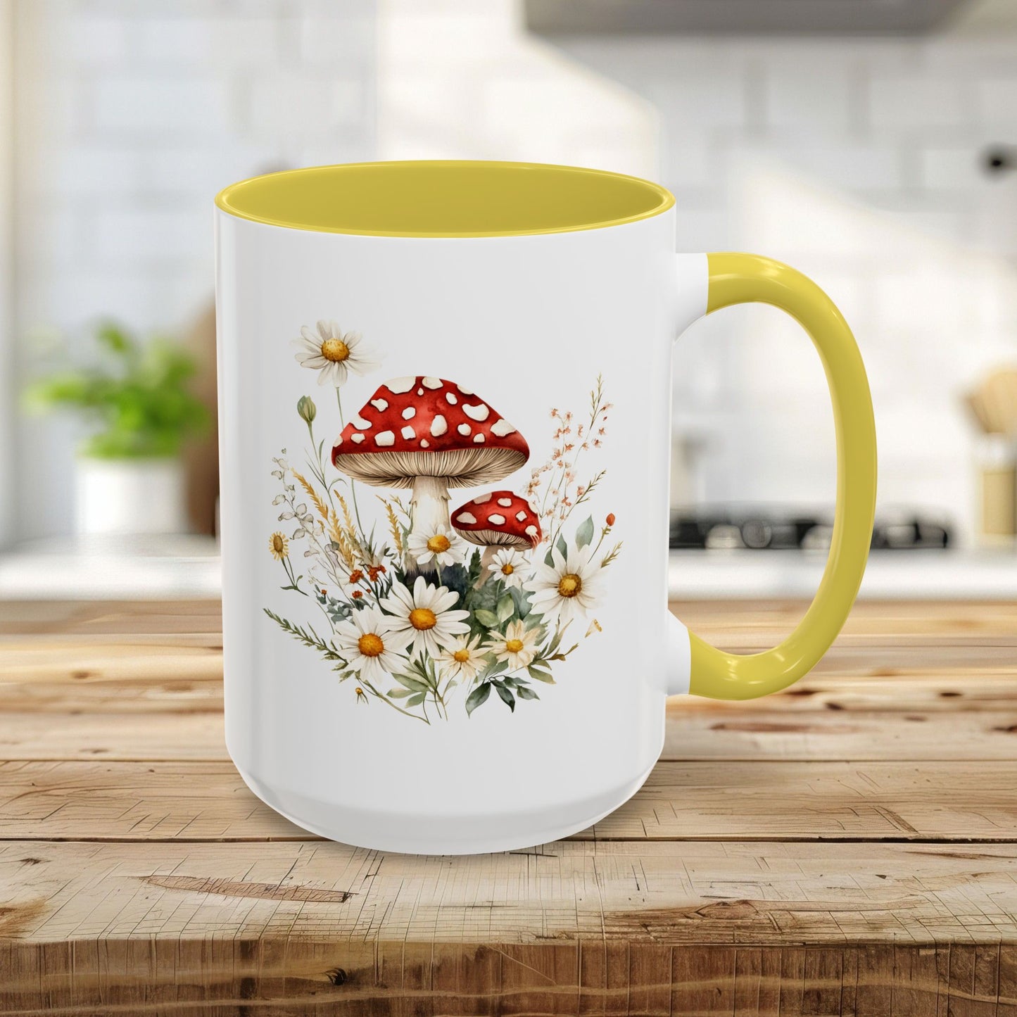15oz ceramic mug with a yellow interior/handle and a watercolor print of red-capped mushrooms and daisies.