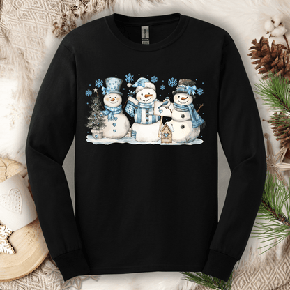 Black long-sleeve tee with three watercolor snowmen, blue hats, scarves, and snowflakes.