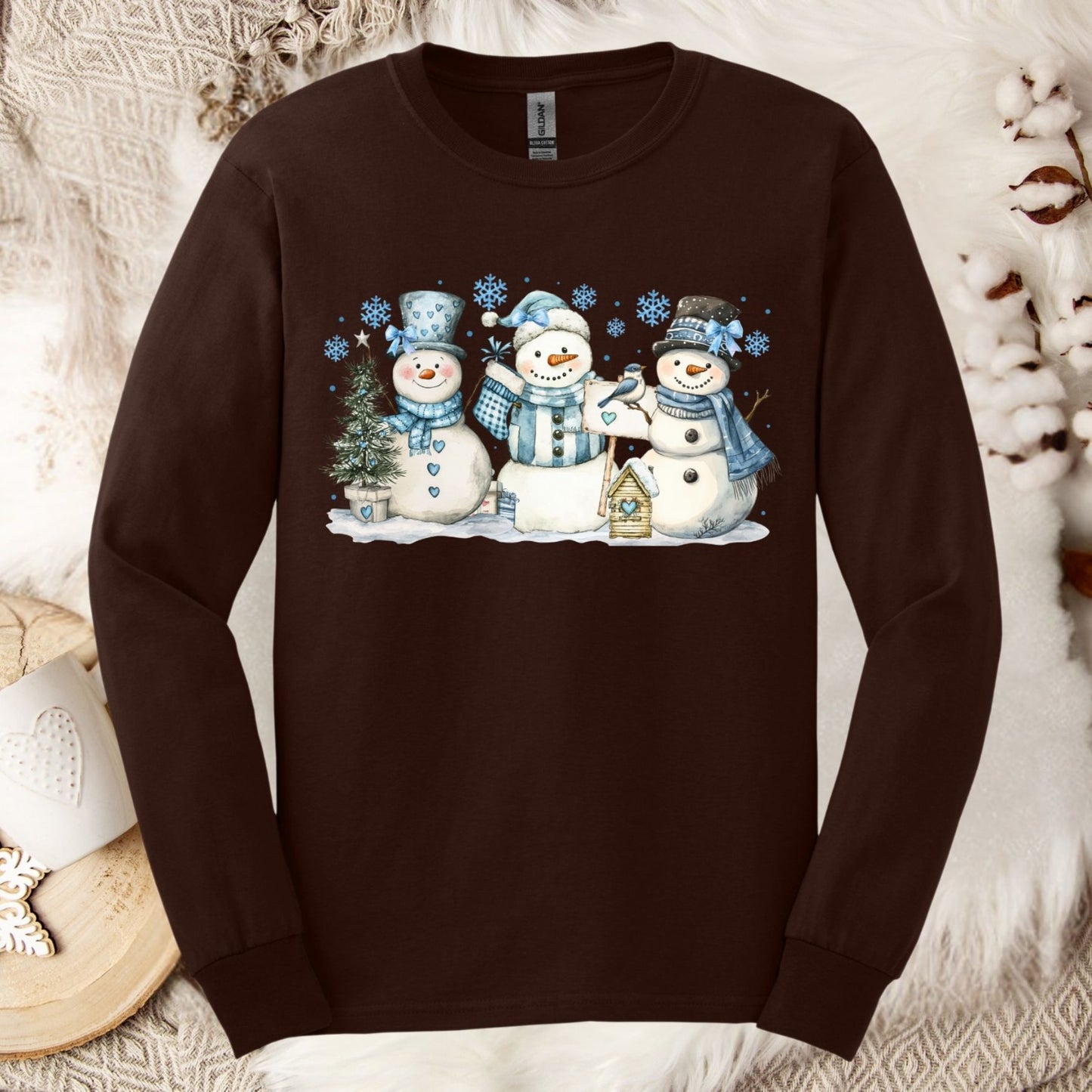 Dark Chocolate long sleeve tee with watercolor snowmen, blue hats, scarves, and snowflakes.