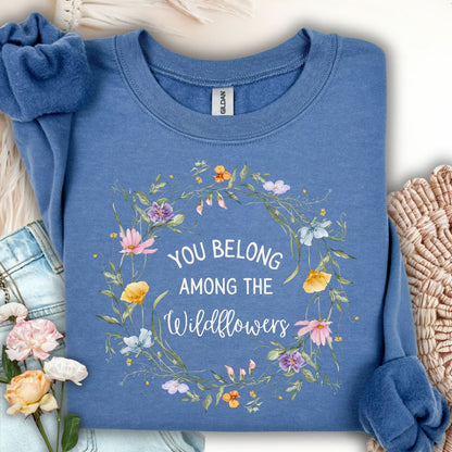 Indigo blue Gildan sweatshirt with "You belong among the wildflowers" in a watercolor floral wreath.